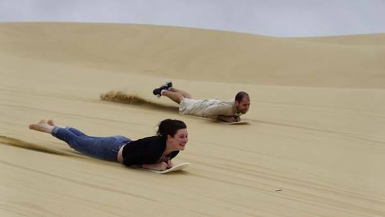 belly-sandboarding